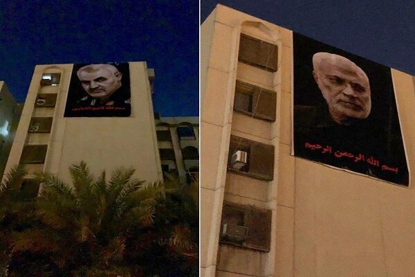 نصب تصاویر شهیدان سلیمانی و ابومهدی مقابل سفارت آمریکا در بغداد